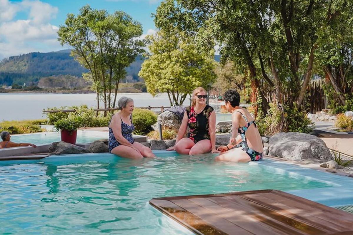 a group of women sitting in a swimming pool
