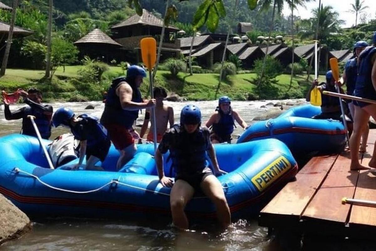 a group of people on a raft in the water