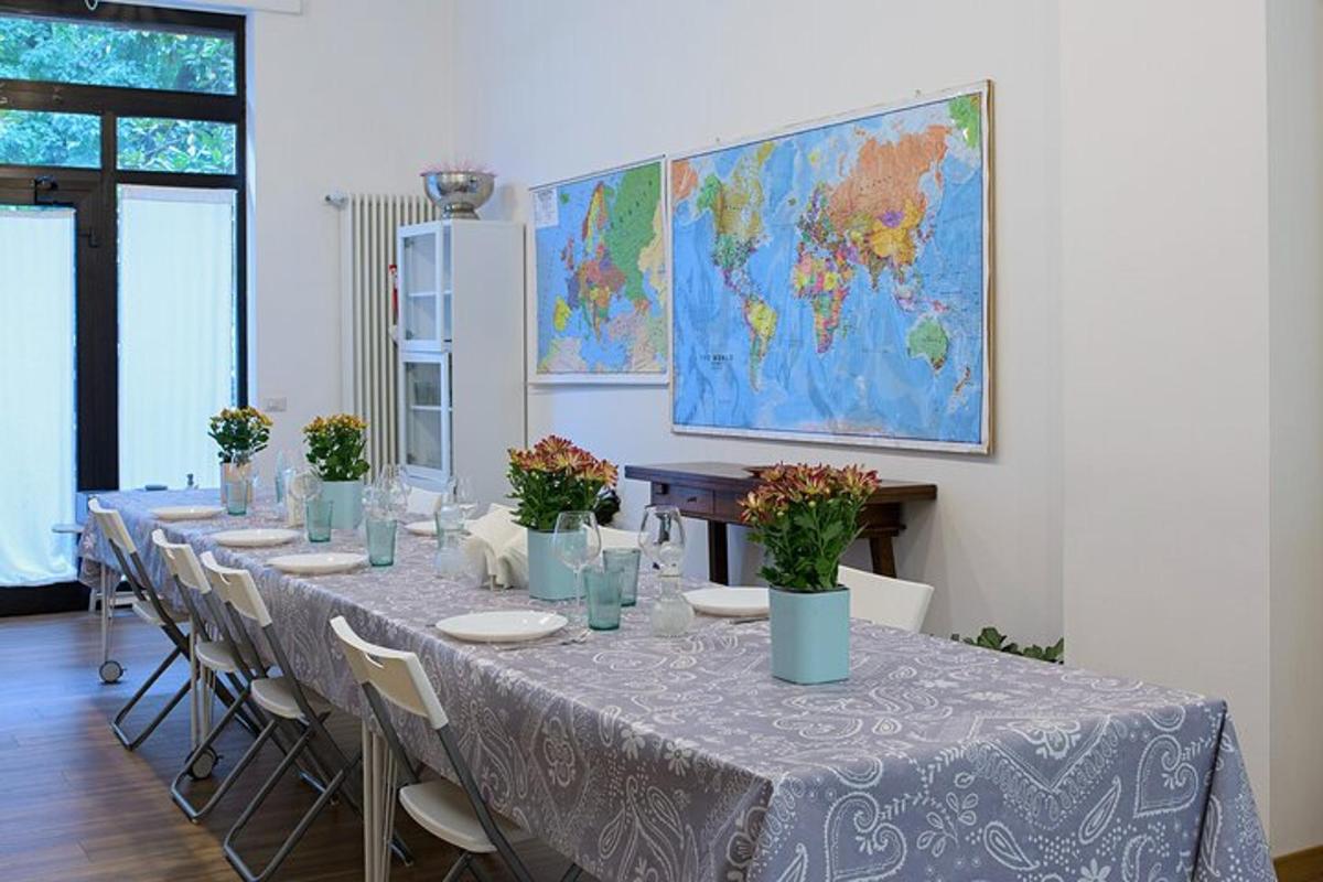 a long table with chairs and a map on the wall