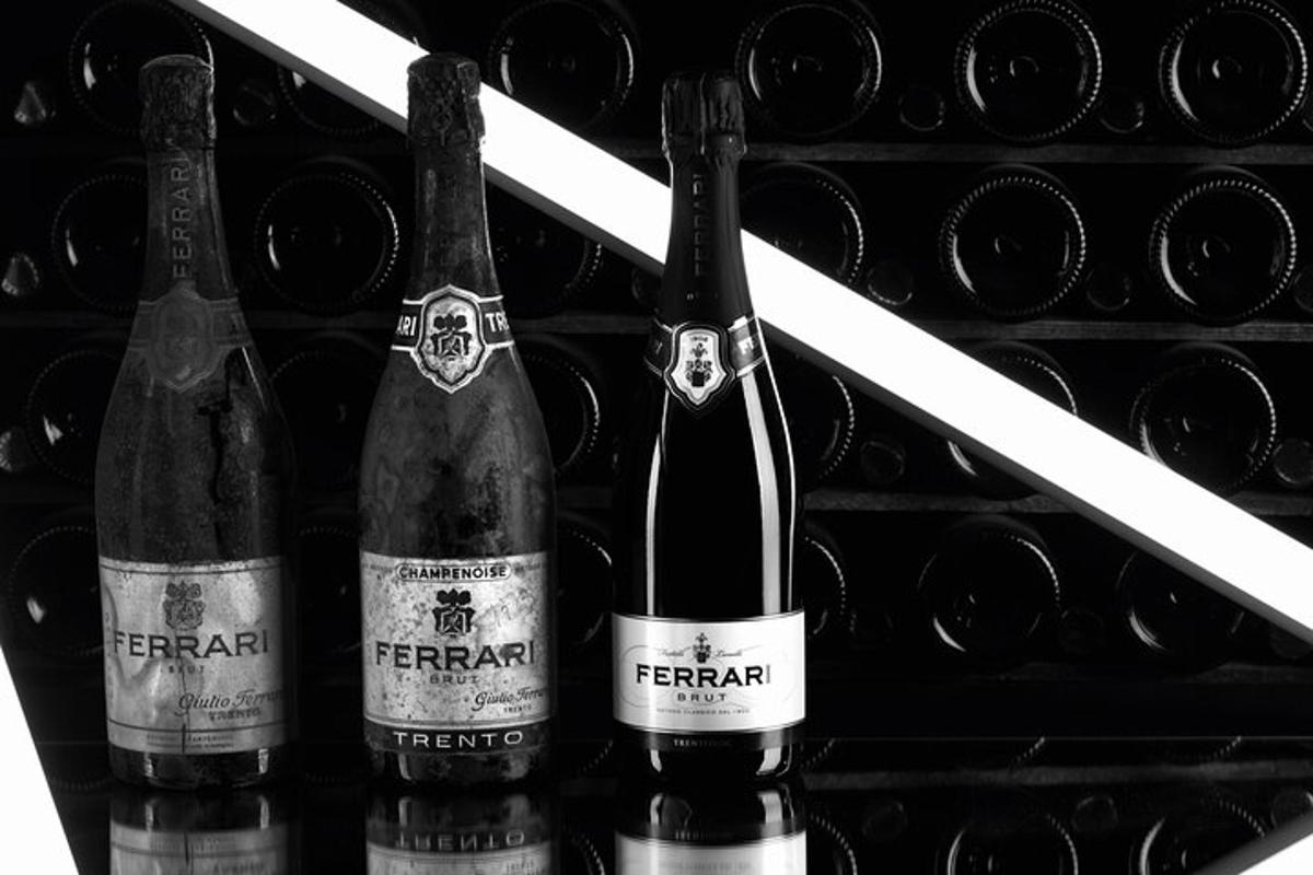 a group of three bottles of wine in a wine rack