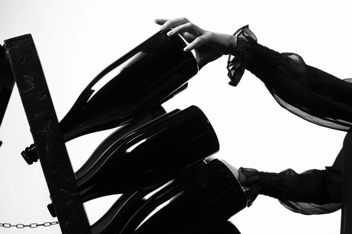 a woman in high heels is drinking from a phone