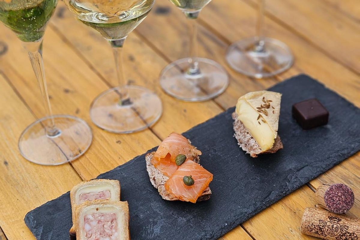 two plates of food and wine glasses on a table