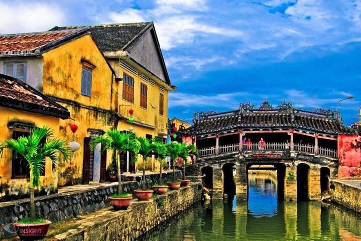 a bridge over a river with buildings and a bridge