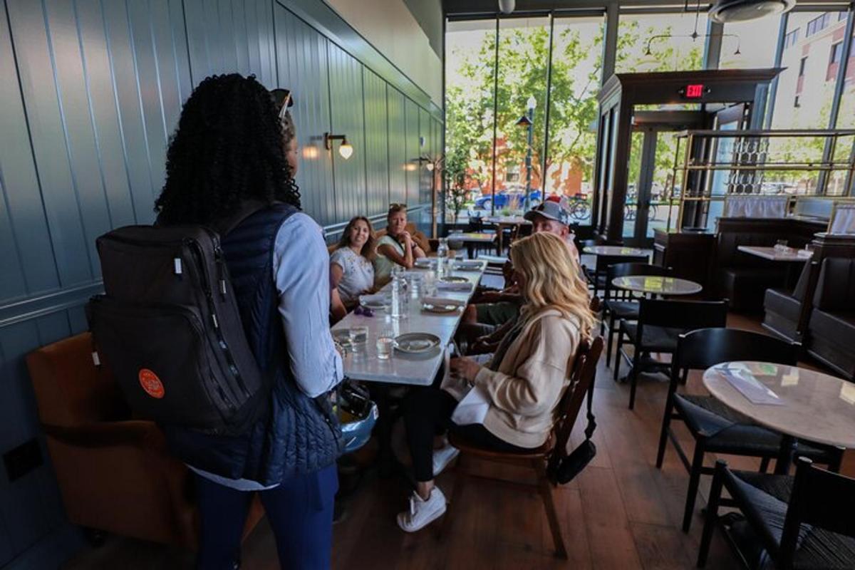 a group of people sitting at a table in a restaurant