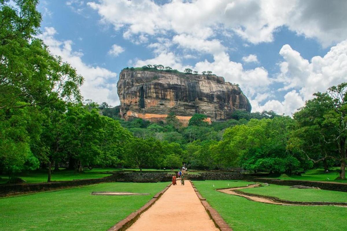 a view of a large rock formation in a park