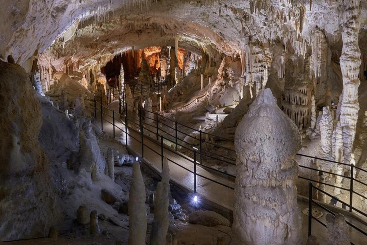 a cave with columns and rock formations in it
