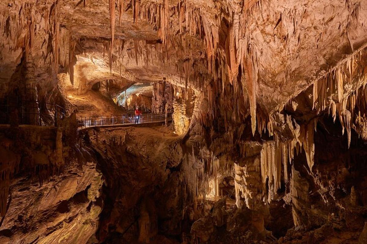 a cave with a tunnel and a bridge in it