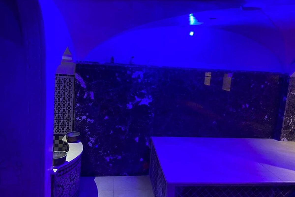 a dark room with a blue lighting in a bathroom