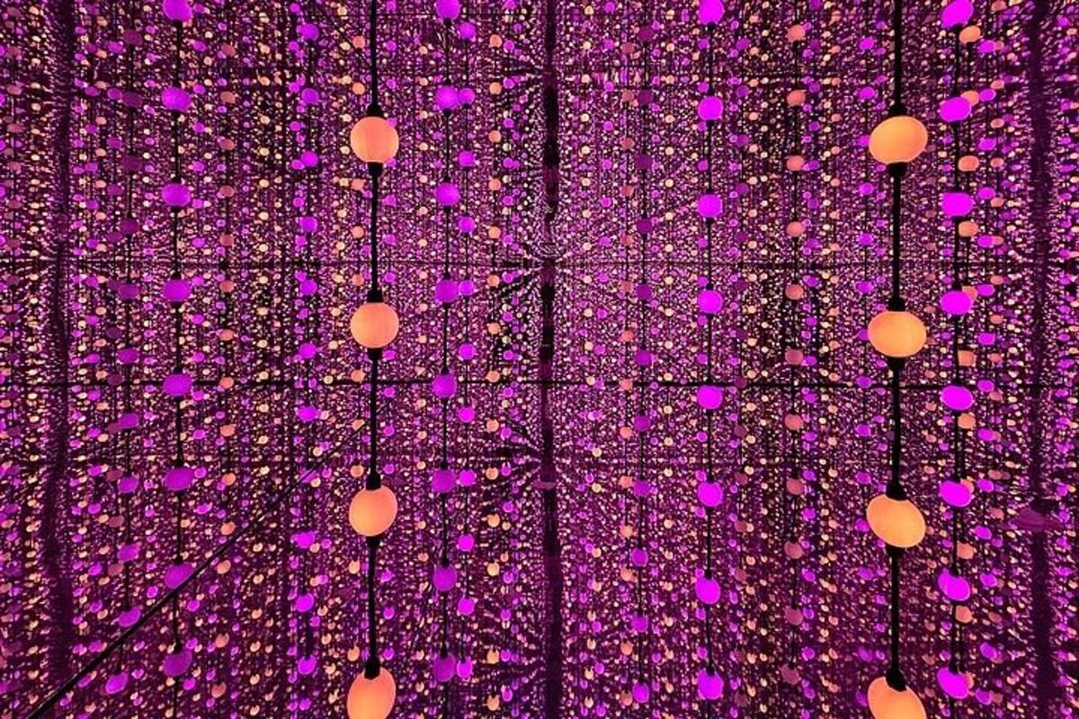 a purple ceiling with pink lights on it