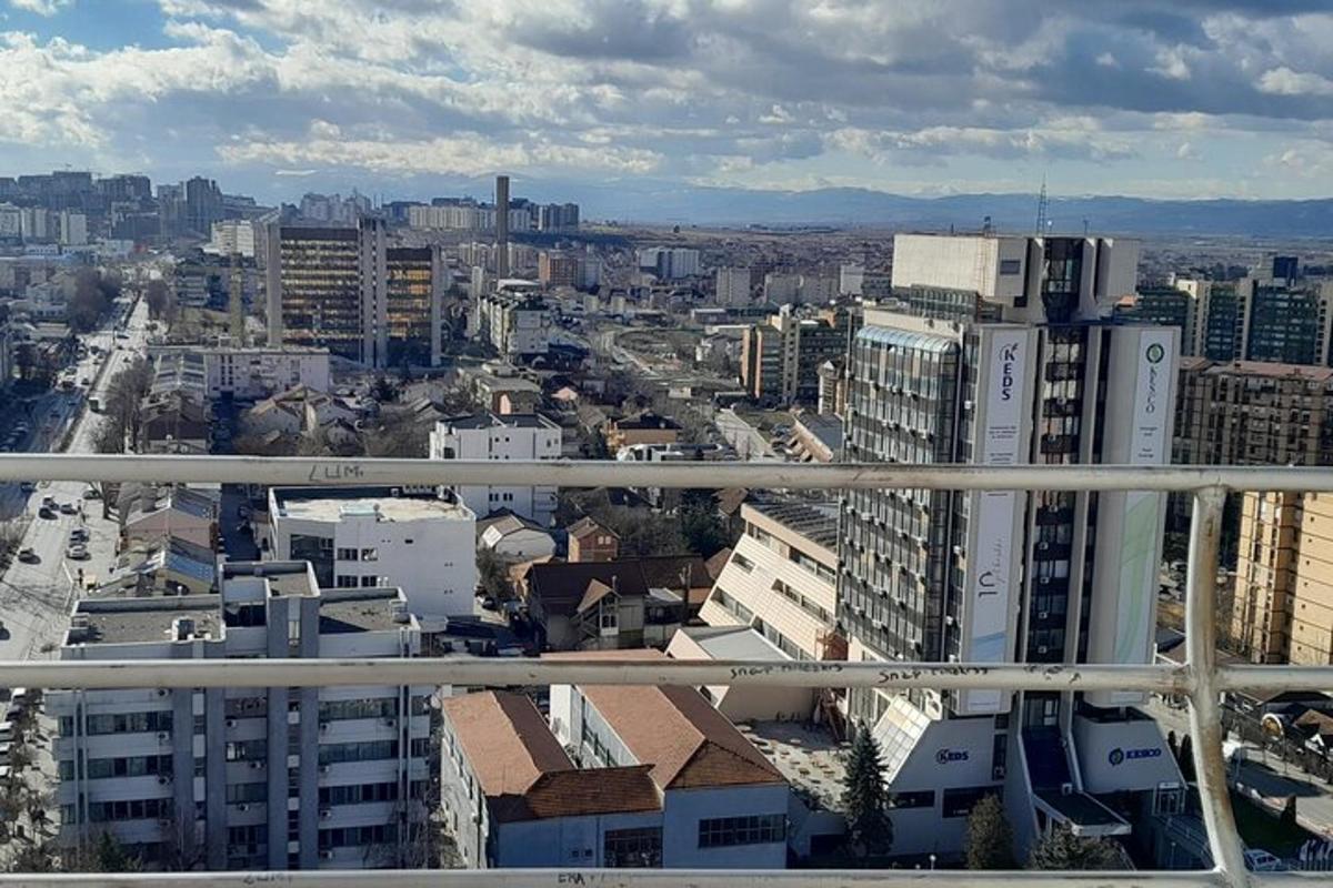 an aerial view of a city with tall buildings