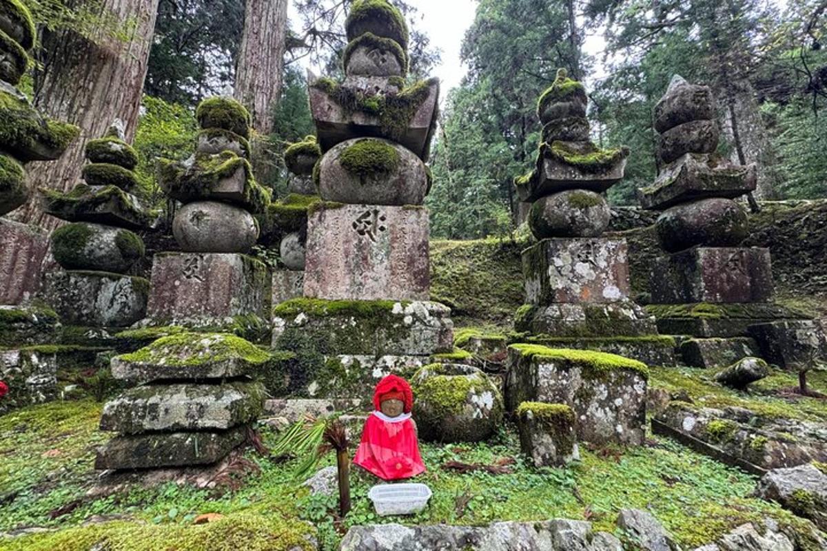 a little girl sitting in front of a stone monument