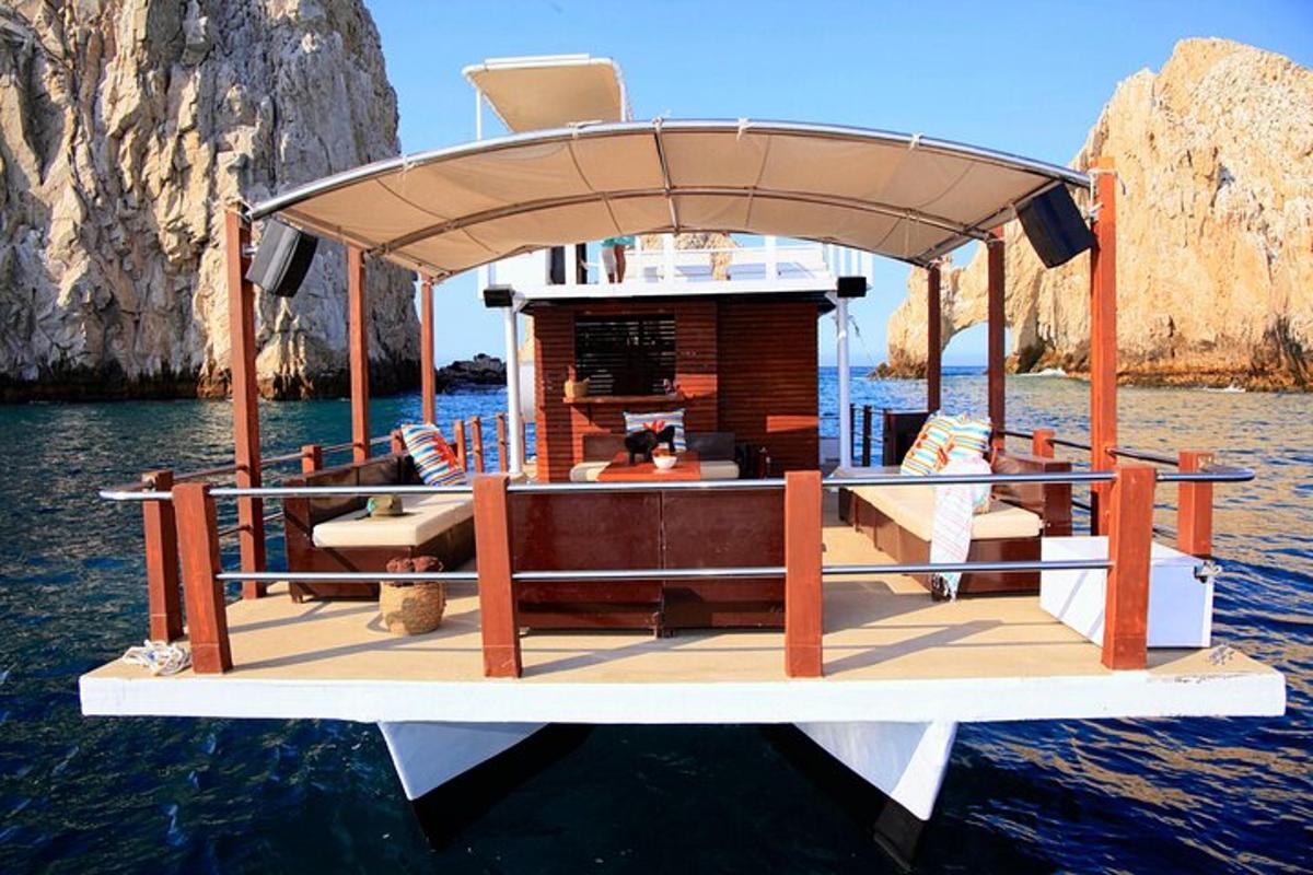 a boat with a roof on the water