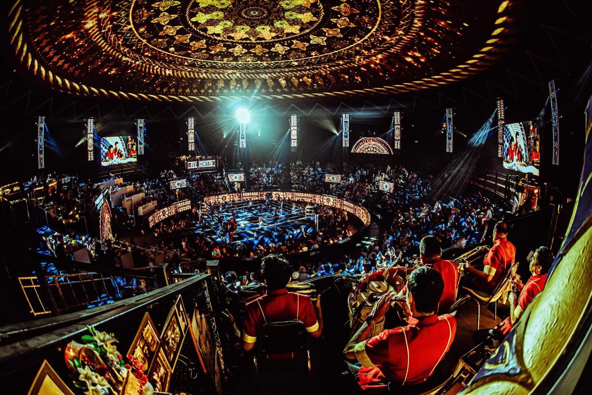 a group of people sitting in an auditorium at a circus