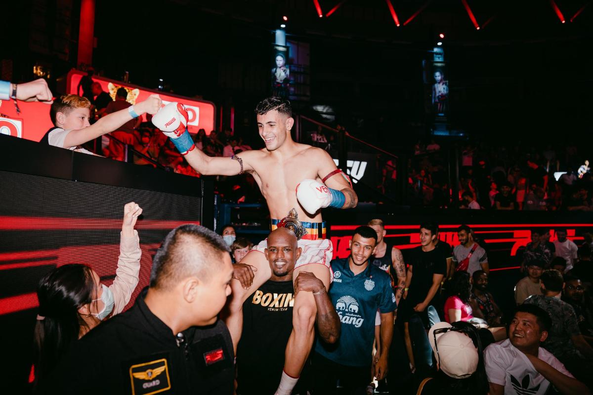 a man is in the middle of a crowd