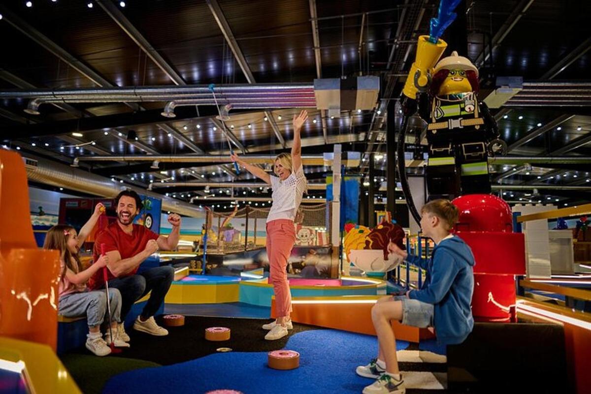 a group of people playing on an indoor playground