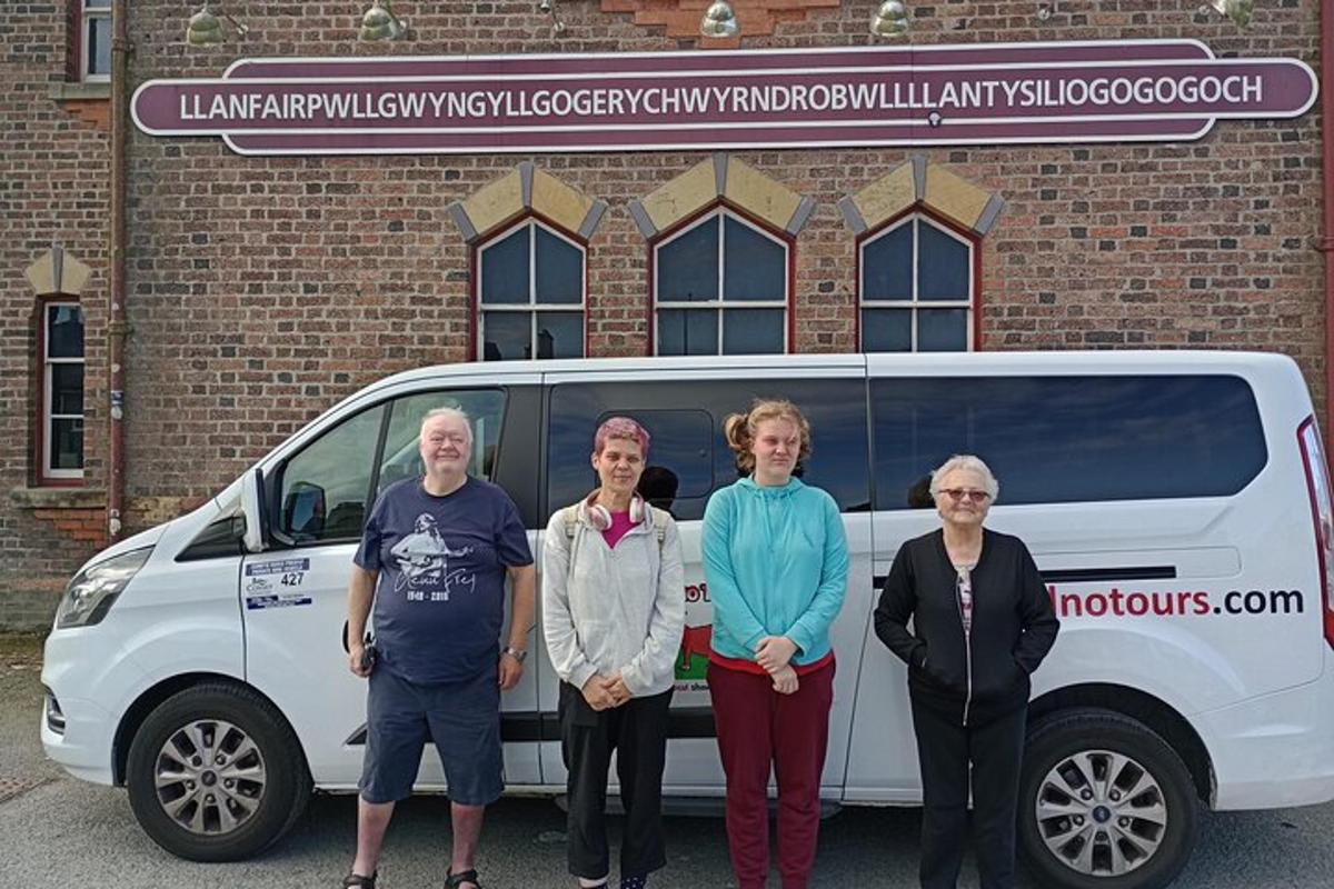a group of people standing in front of a van
