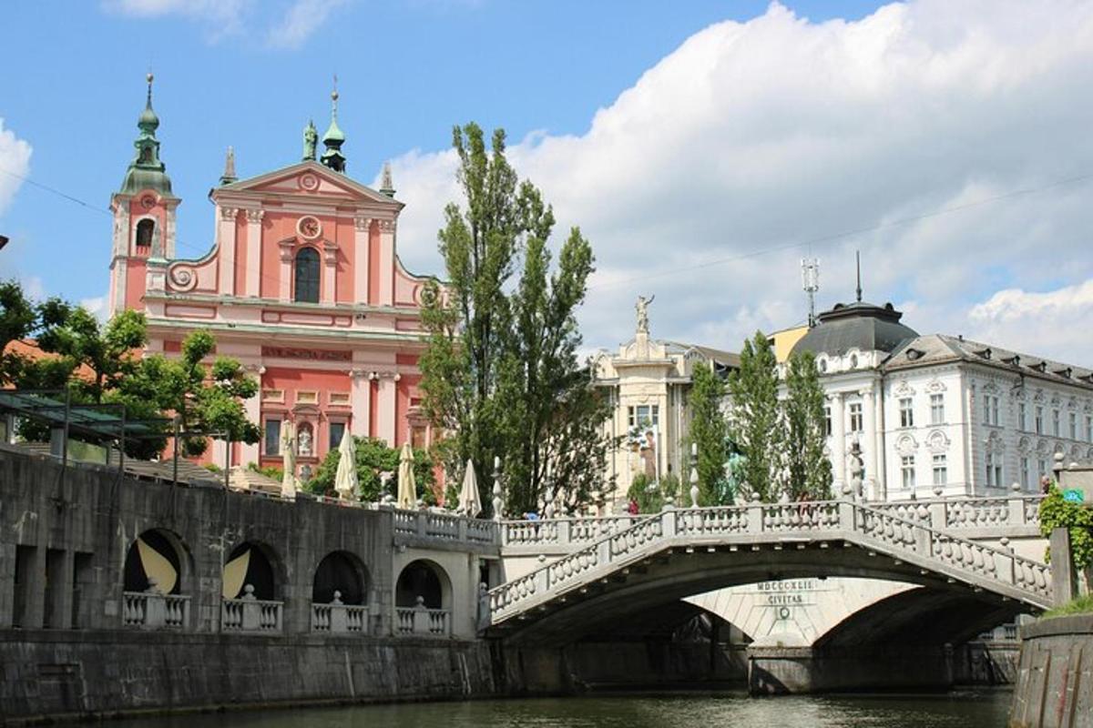 a bridge over a river in front of a building