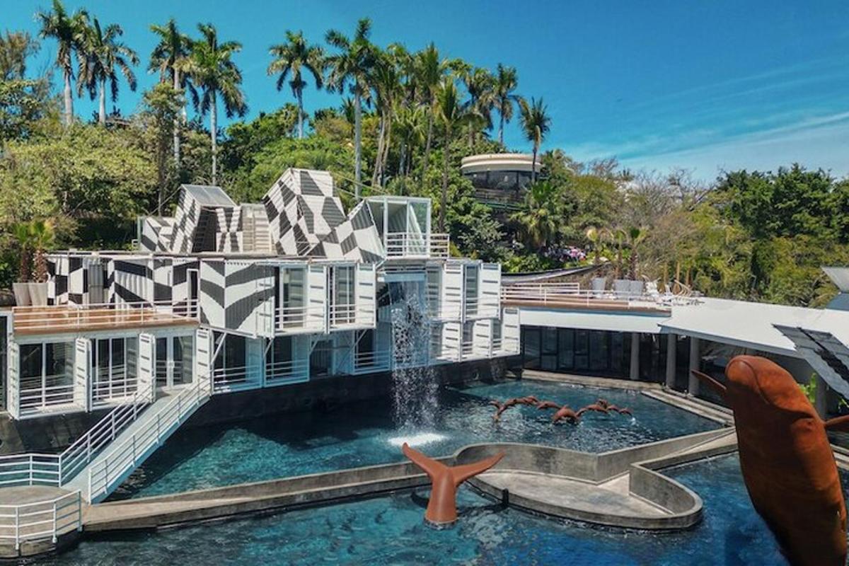 a large house with a swimming pool and a fountain