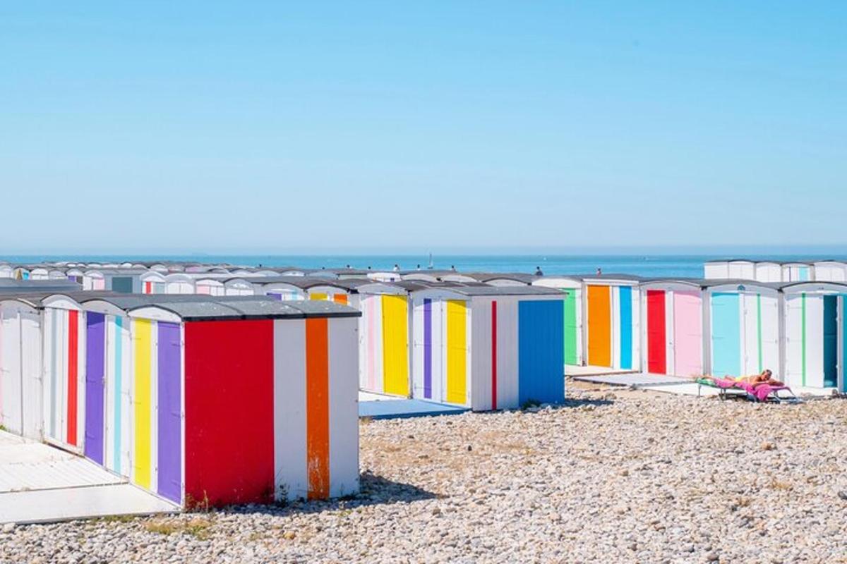 a row of colorful beach huts on a beach