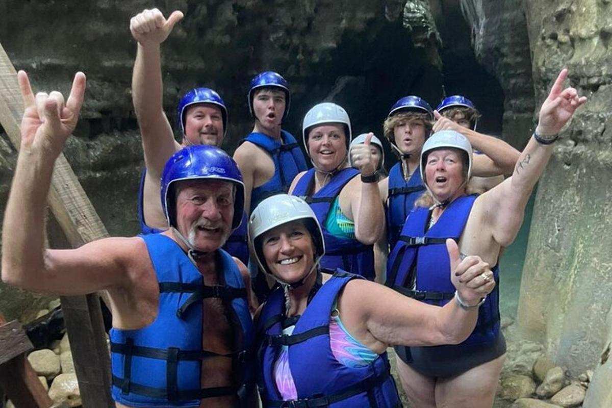 a group of people posing for a picture on a raft
