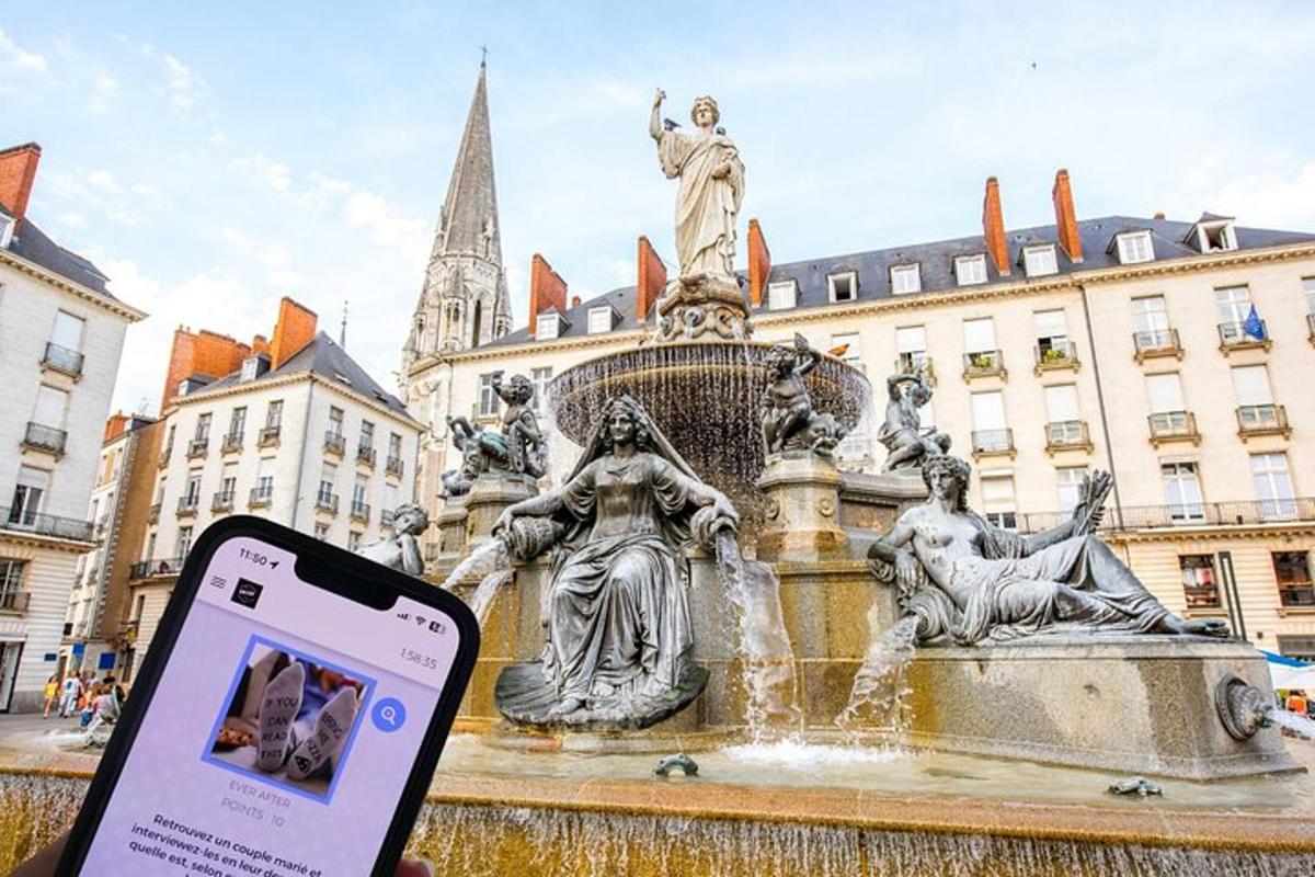 a person holding a cell phone in front of a fountain