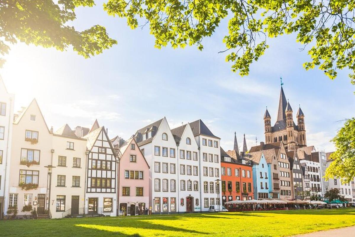 a row of buildings with a church in the background