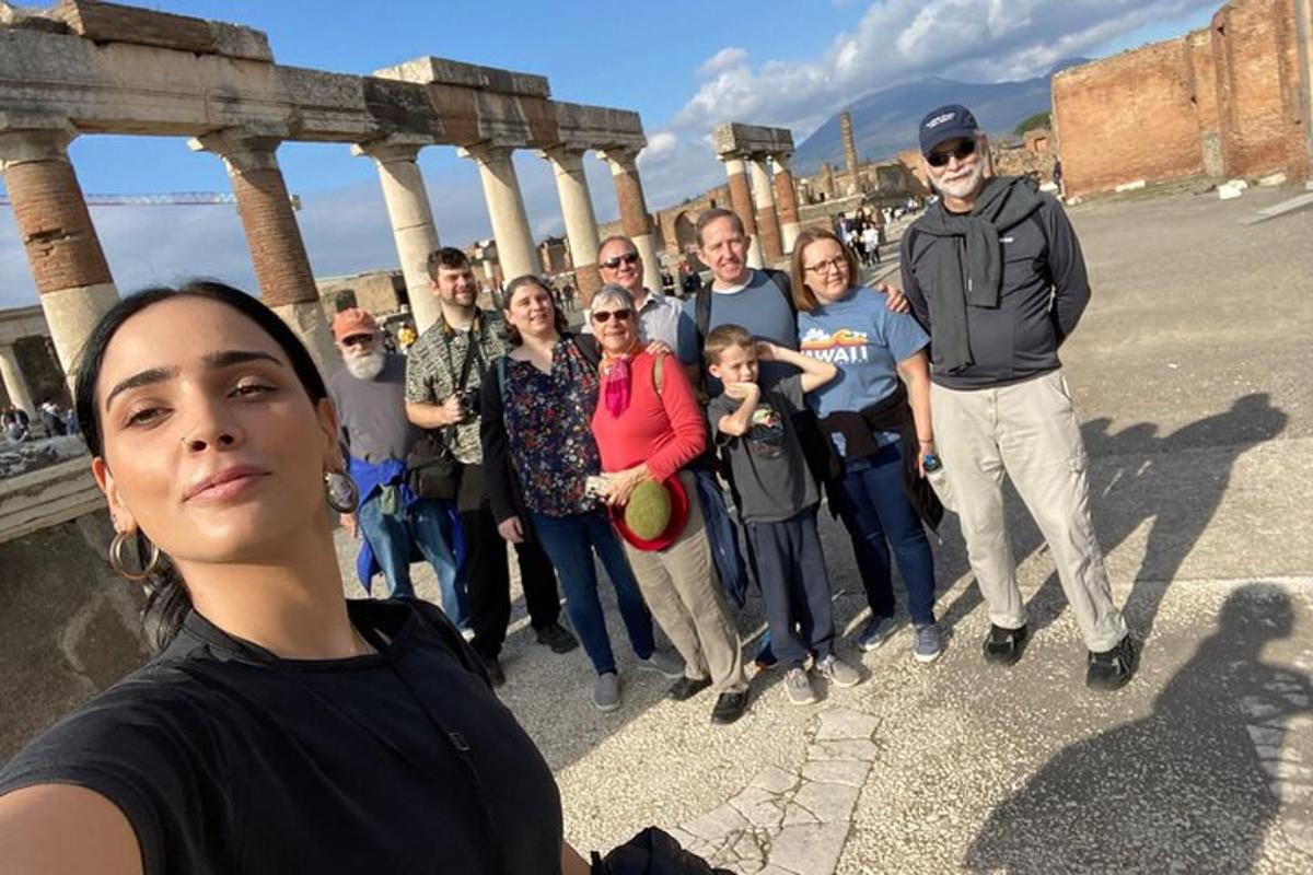 a group of people posing for a picture in front