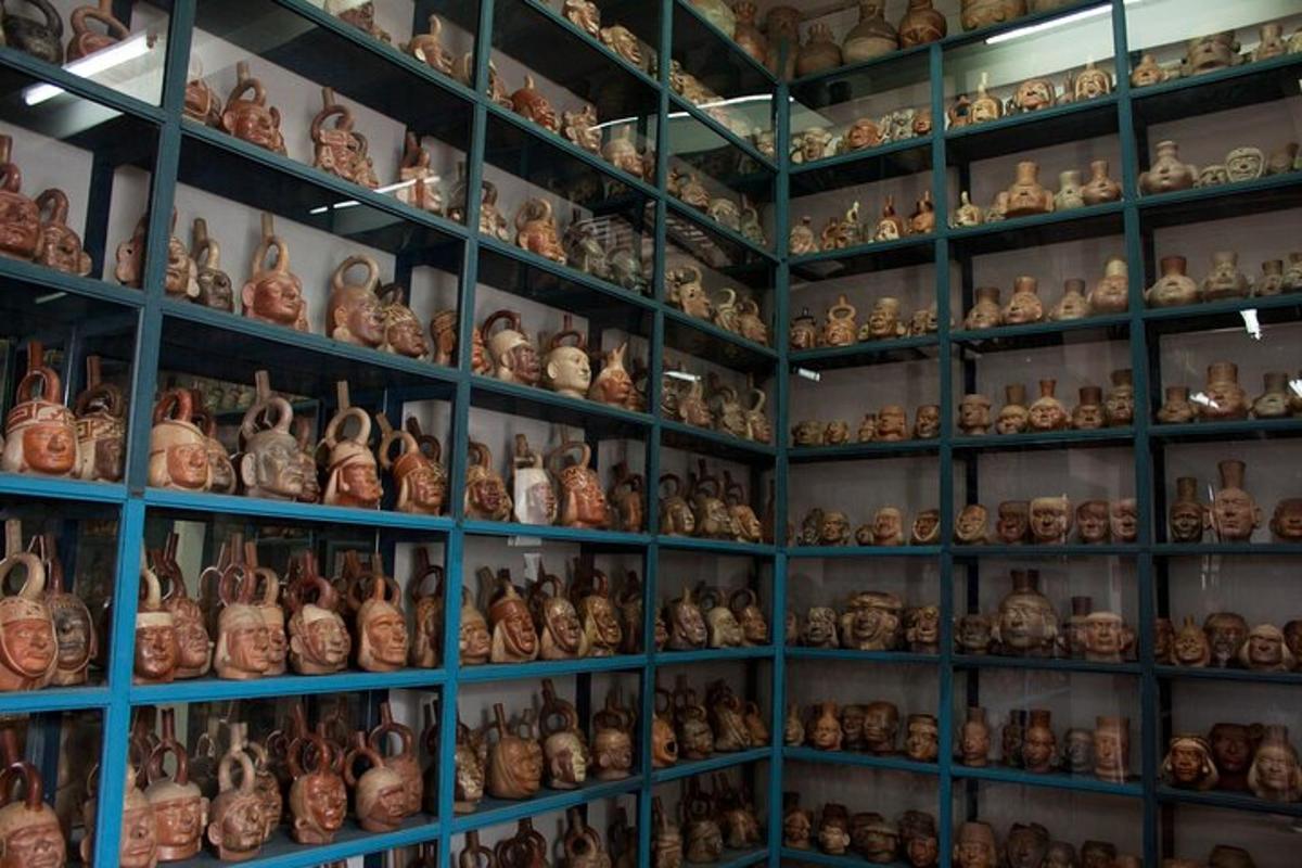 a room filled with lots of vases on shelves