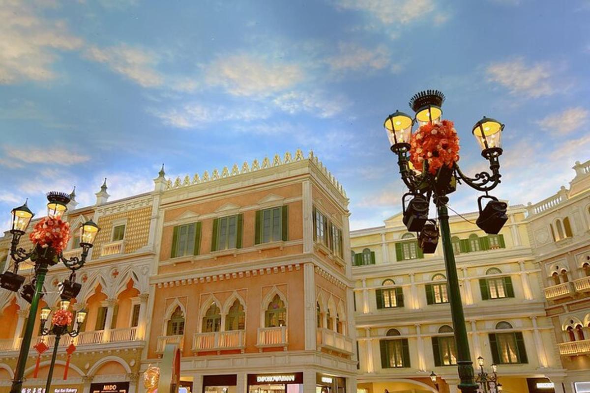 a large building with street lights in front of it