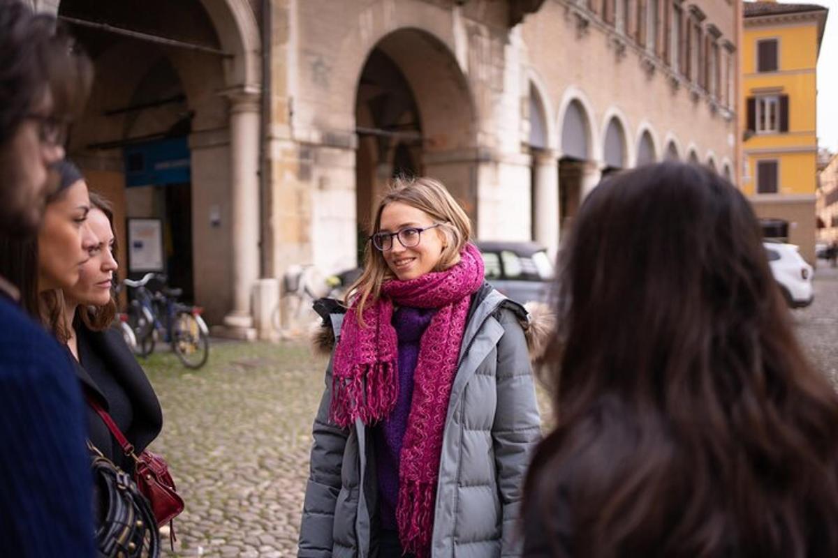 a woman standing in a group of people on a street