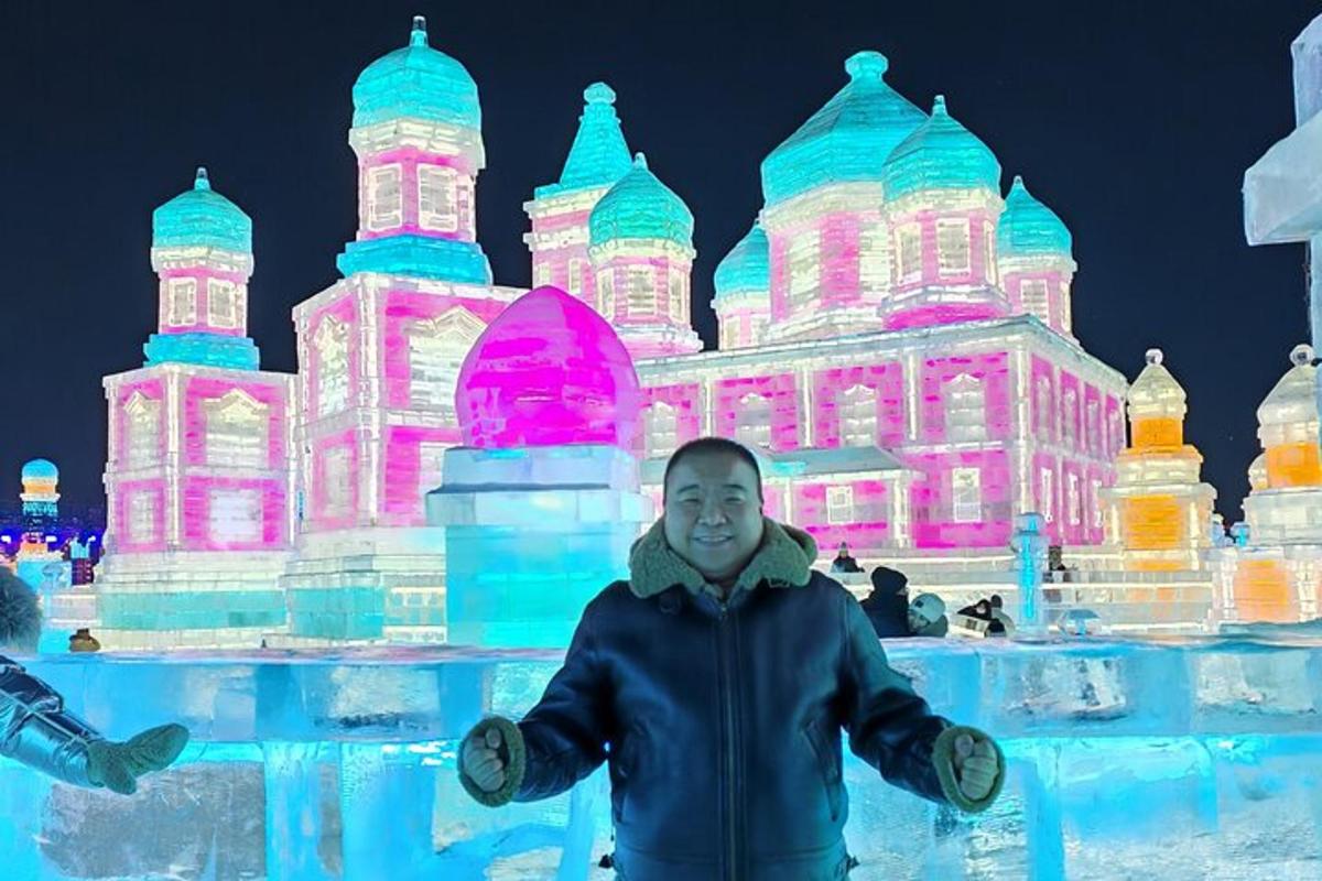 a man standing in front of an ice sculpture