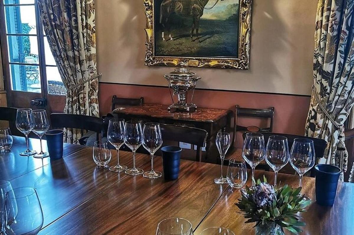 a room with a table with wine glasses on it