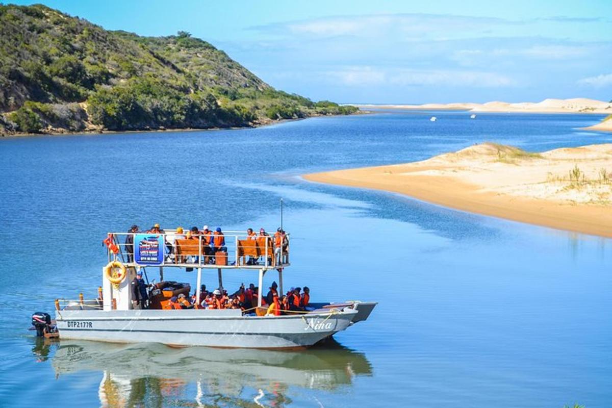 a group of people on a boat in the water