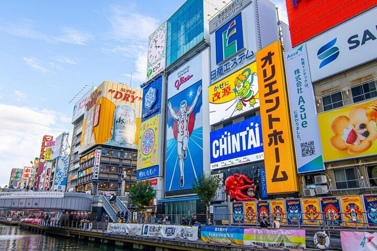 a group of buildings with signs in a city