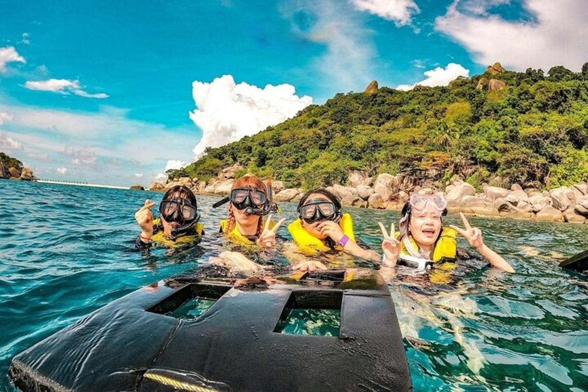 a group of people in the water on a boat