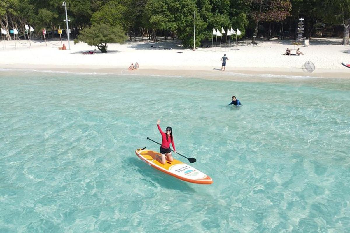 a person riding a paddle board in the ocean