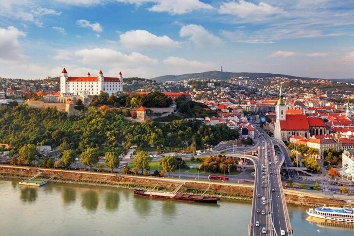 a city with a bridge over a river and a city