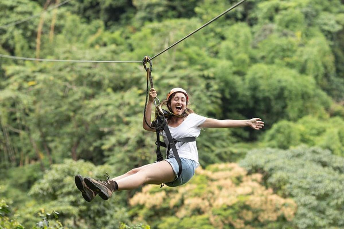 a woman is jumping on a zip line