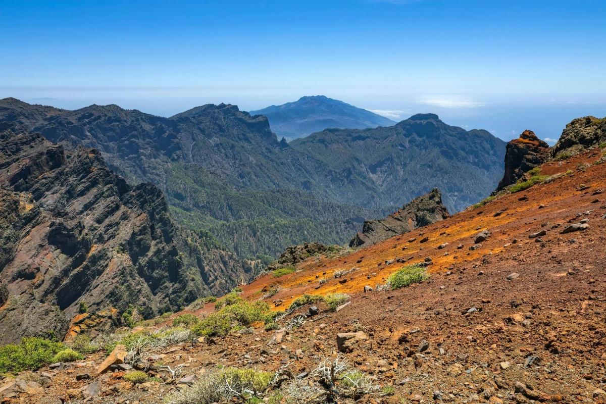 a view of the mountains from the top of a mountain