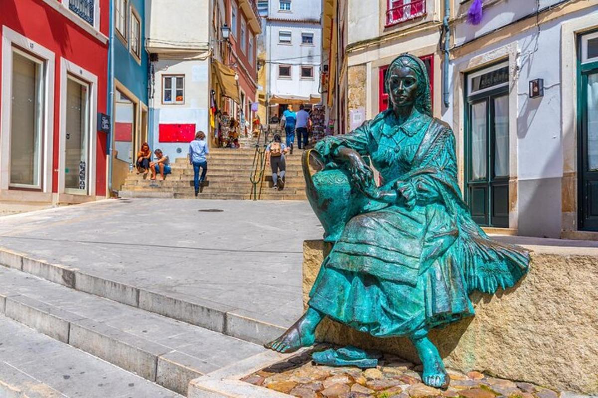 a statue of a woman sitting on a steps