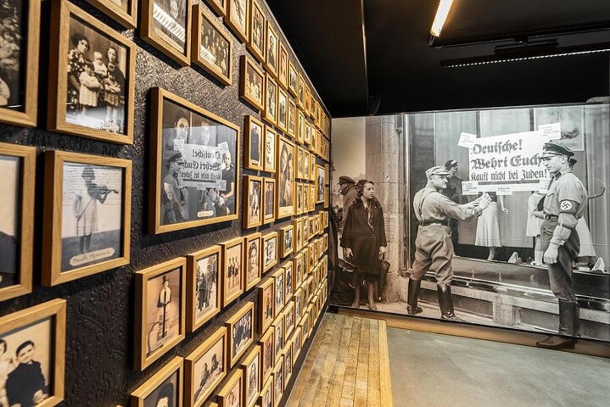a group of people looking at a wall of pictures