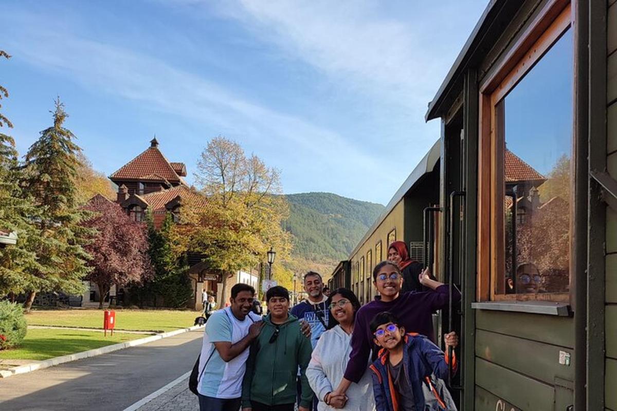 a group of people standing outside of a train