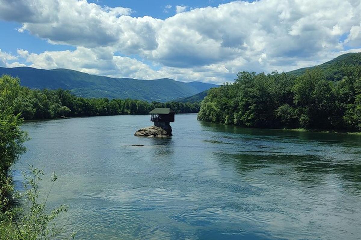 a river with a small island in the middle