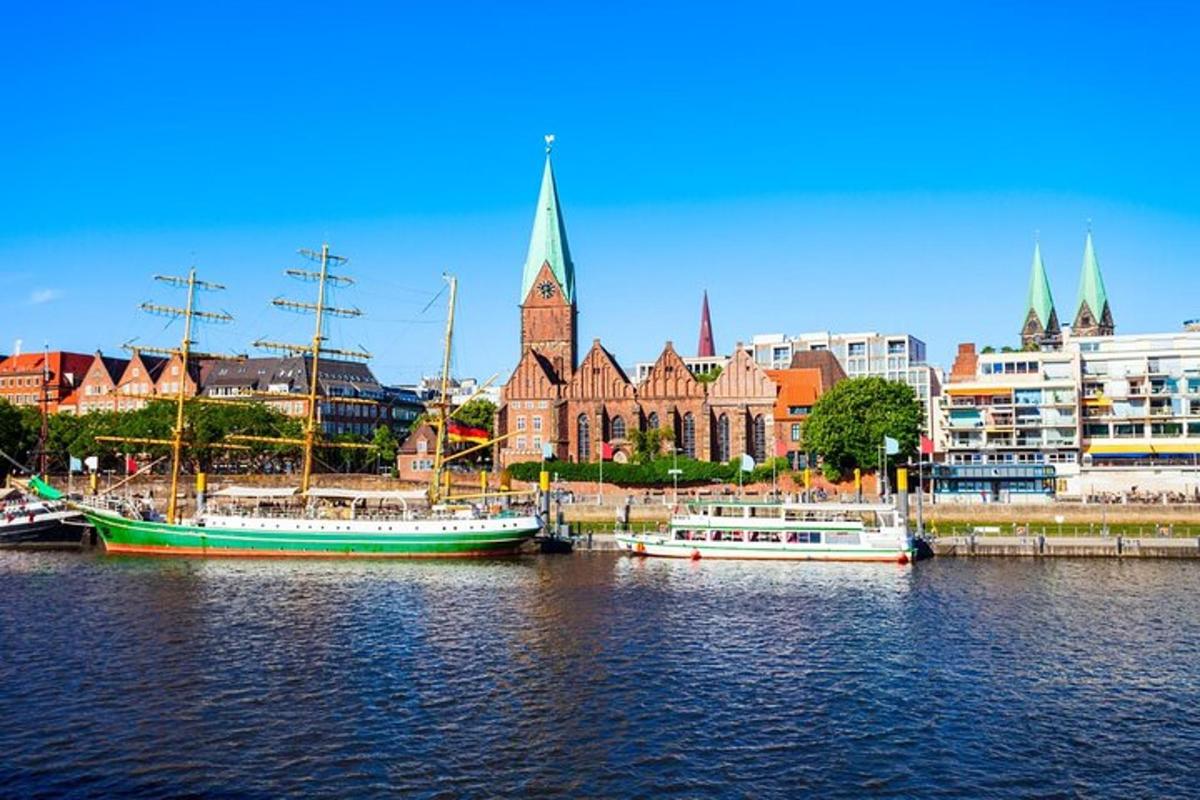 two boats docked in the water in front of a city