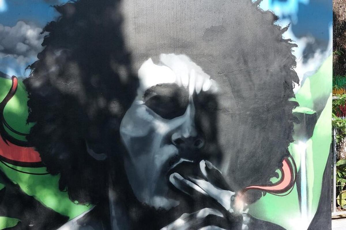 a painting of a mans face on a wall