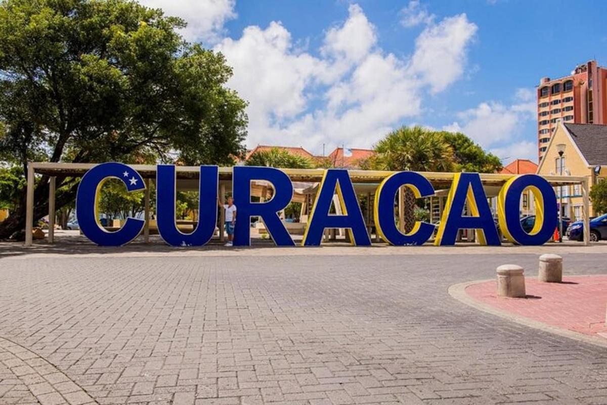 a large blue sign that says curacao