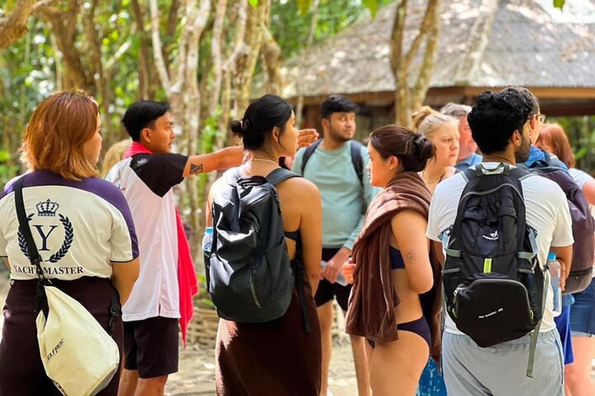 a group of people standing in a line with backpacks
