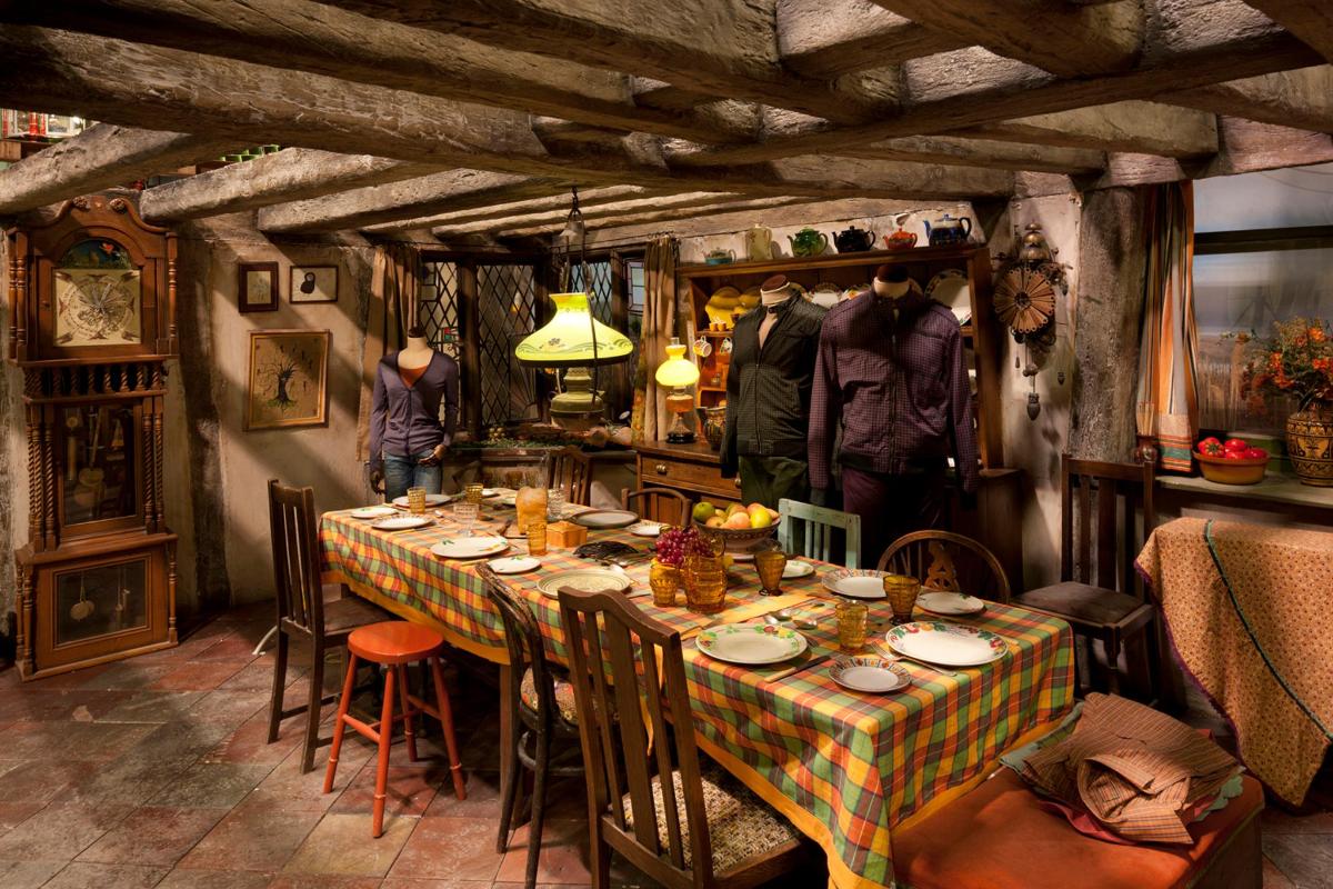 a dining room with a long table and chairs