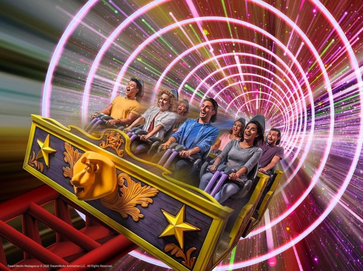 a group of people riding on a roller coaster