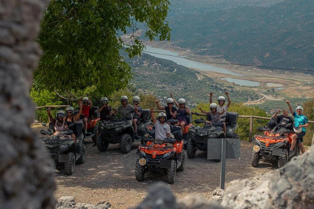 a group of people riding atvs on a hill